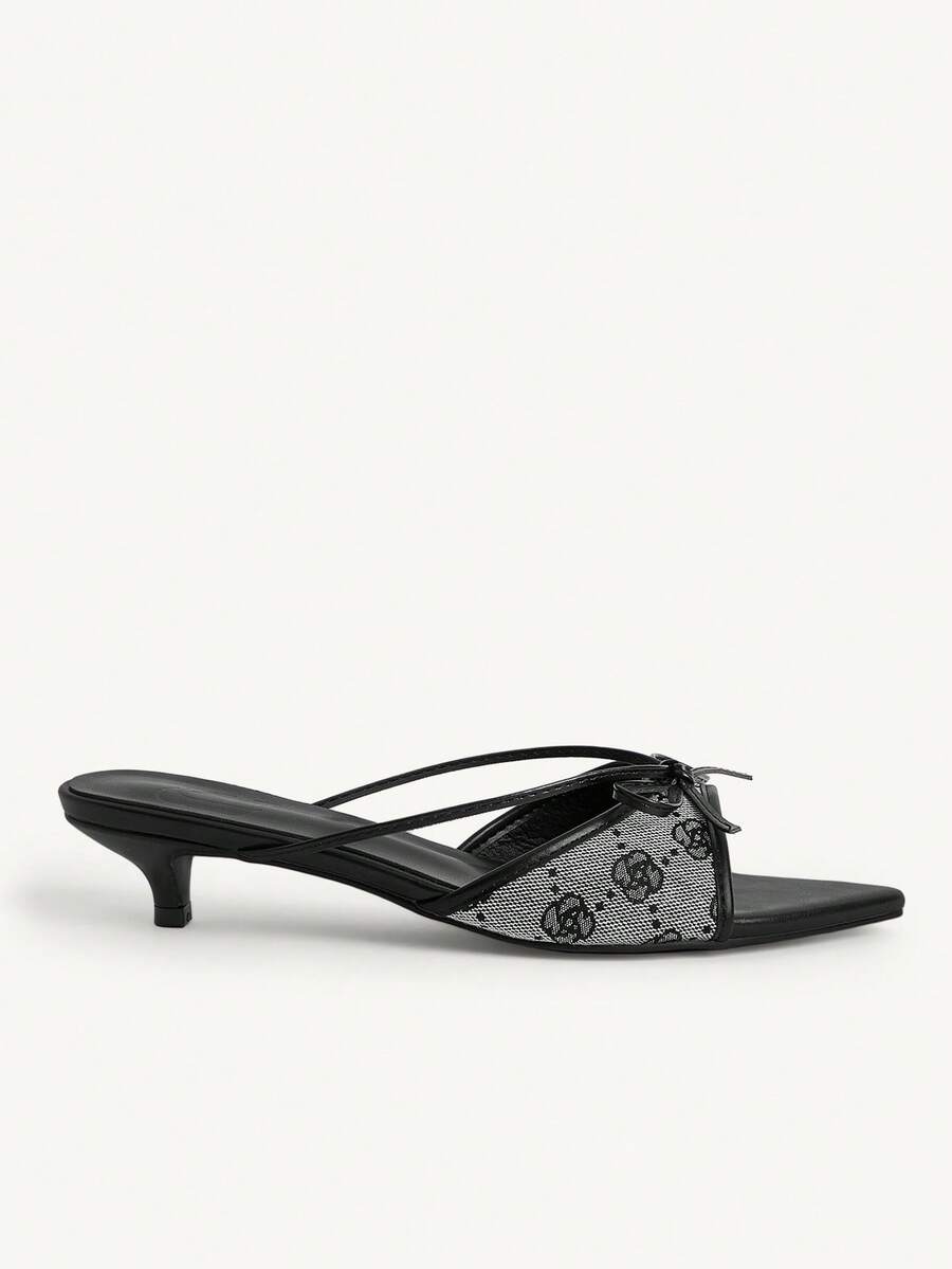 Pointed toe high-heeled slippers in PU leather with decorative buckle detail and low kitten heels for women.