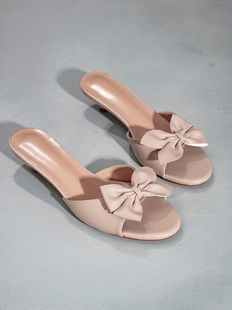 Elegant women's black stiletto heel sandals with open toe slingback design and PU leather upper.