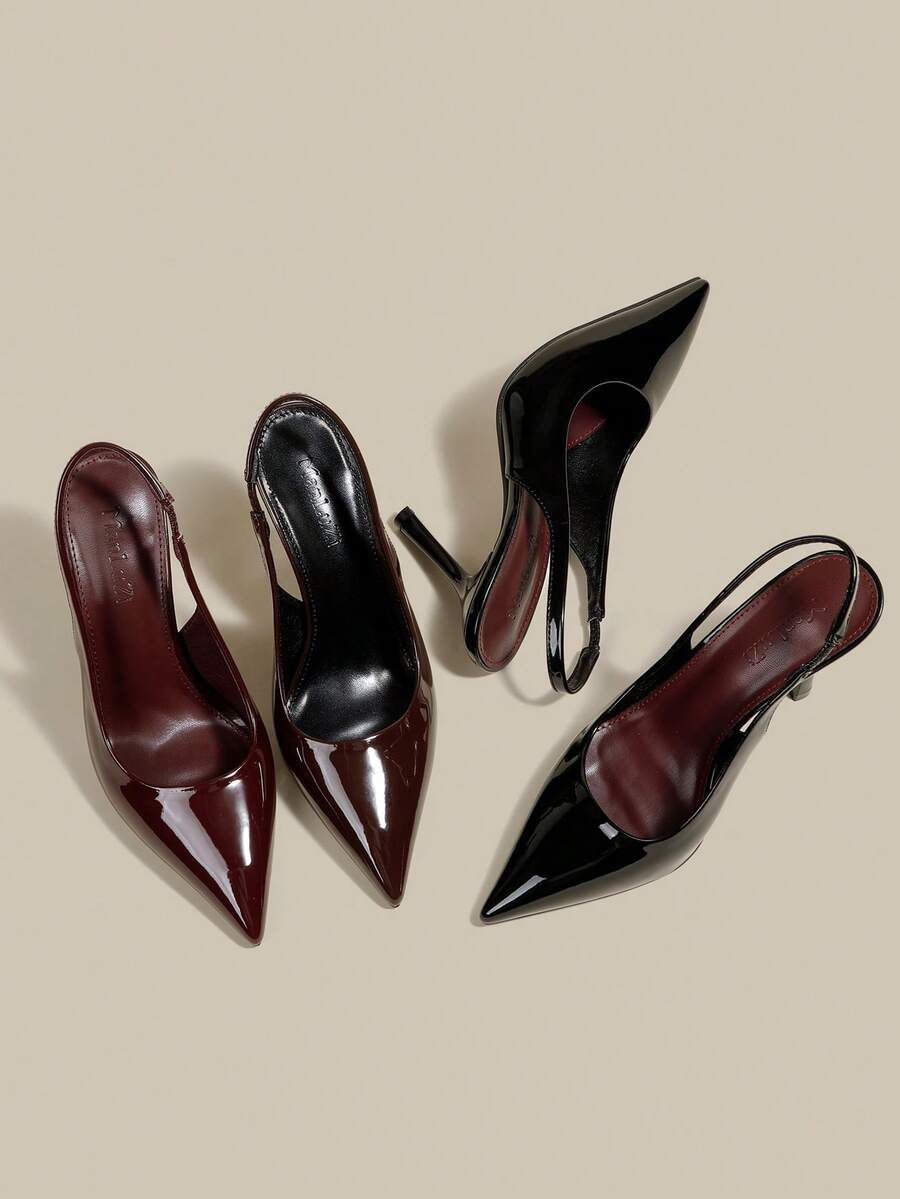 Women's pointed toe kitten heel pumps with adjustable buckle back strap and sleek patent finish.