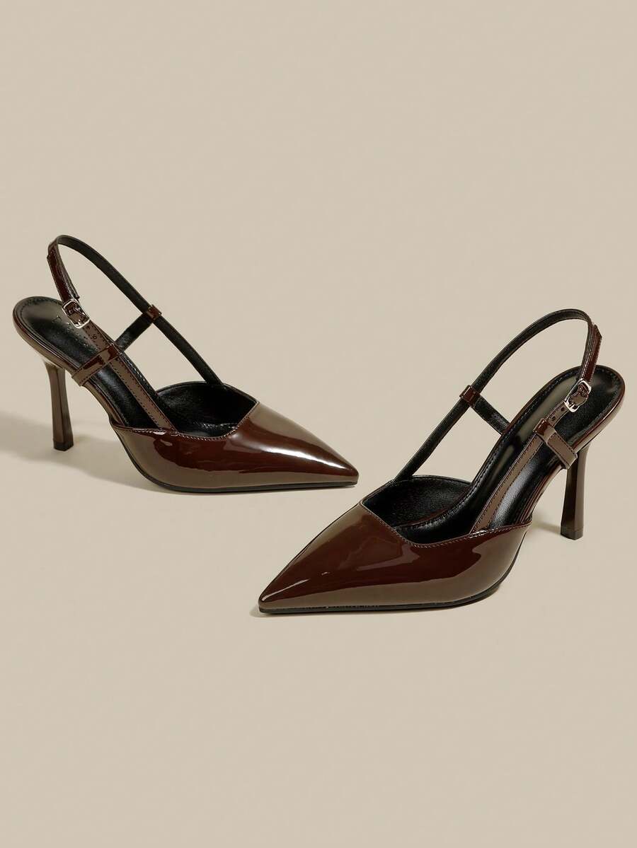Women's pointed toe kitten heel pumps with adjustable buckle back strap and sleek patent finish.