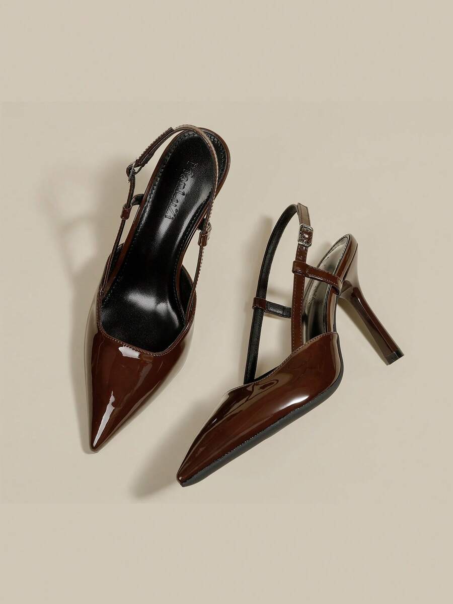 Women's pointed toe kitten heel pumps with adjustable buckle back strap and sleek patent finish.