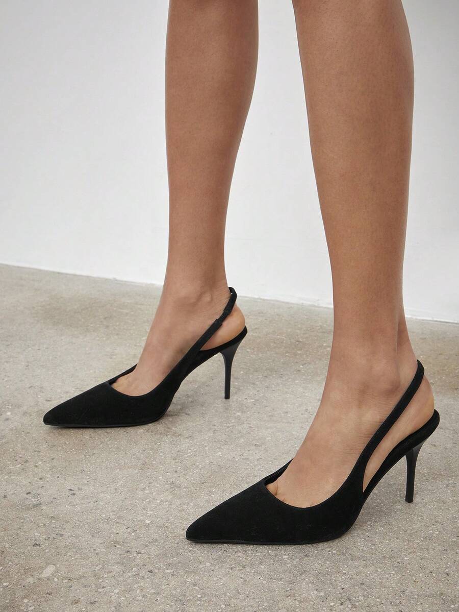 Women's pointed toe stiletto heel slingback pumps in chocolate brown with double metal buckle strap details.
