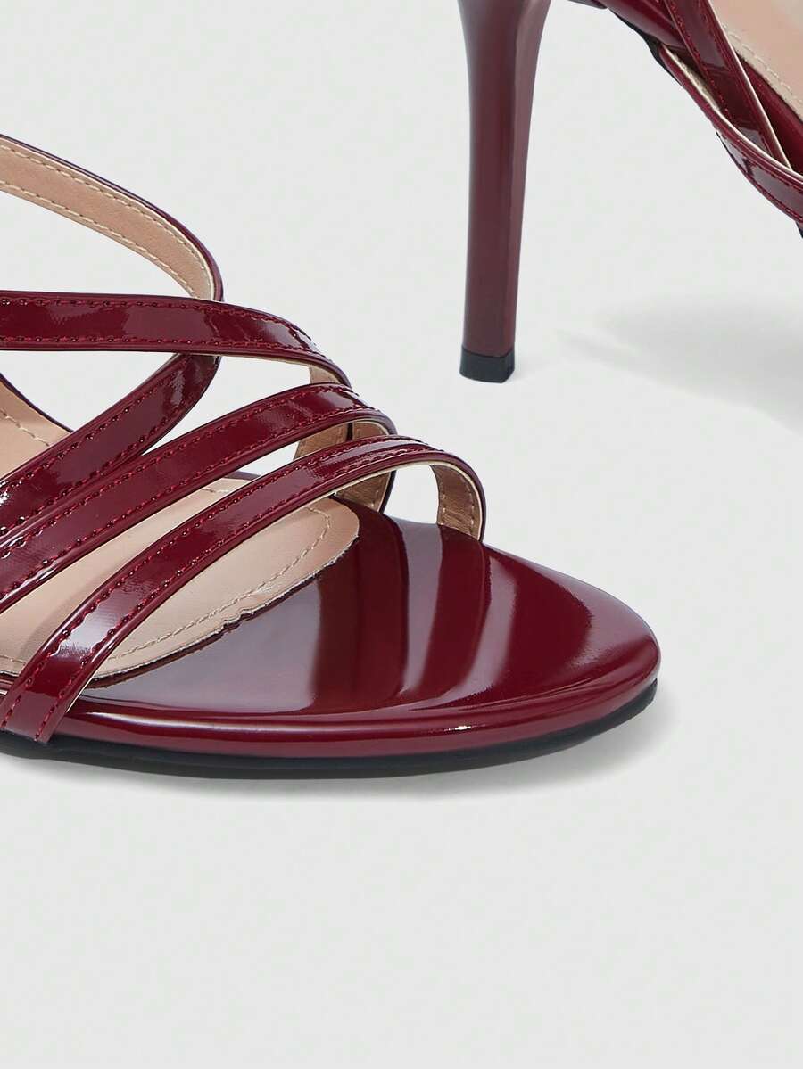 Women's square toe high heel sandals featuring crystal embellishments and crossover ankle straps with buckle closure