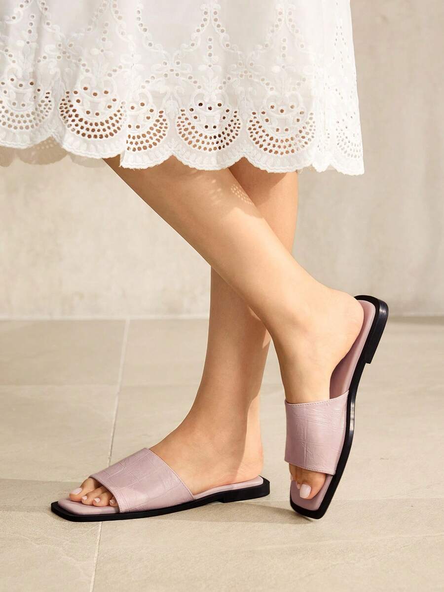 Retro women's square toe open toe flat slippers featuring a smooth PU leather finish and lightweight slip-on design.