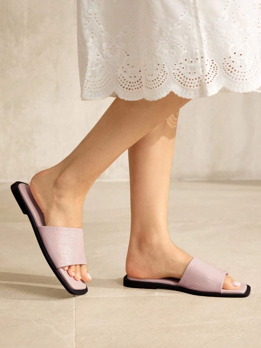 Retro women's square toe open toe flat slippers featuring a smooth PU leather finish and lightweight slip-on design.