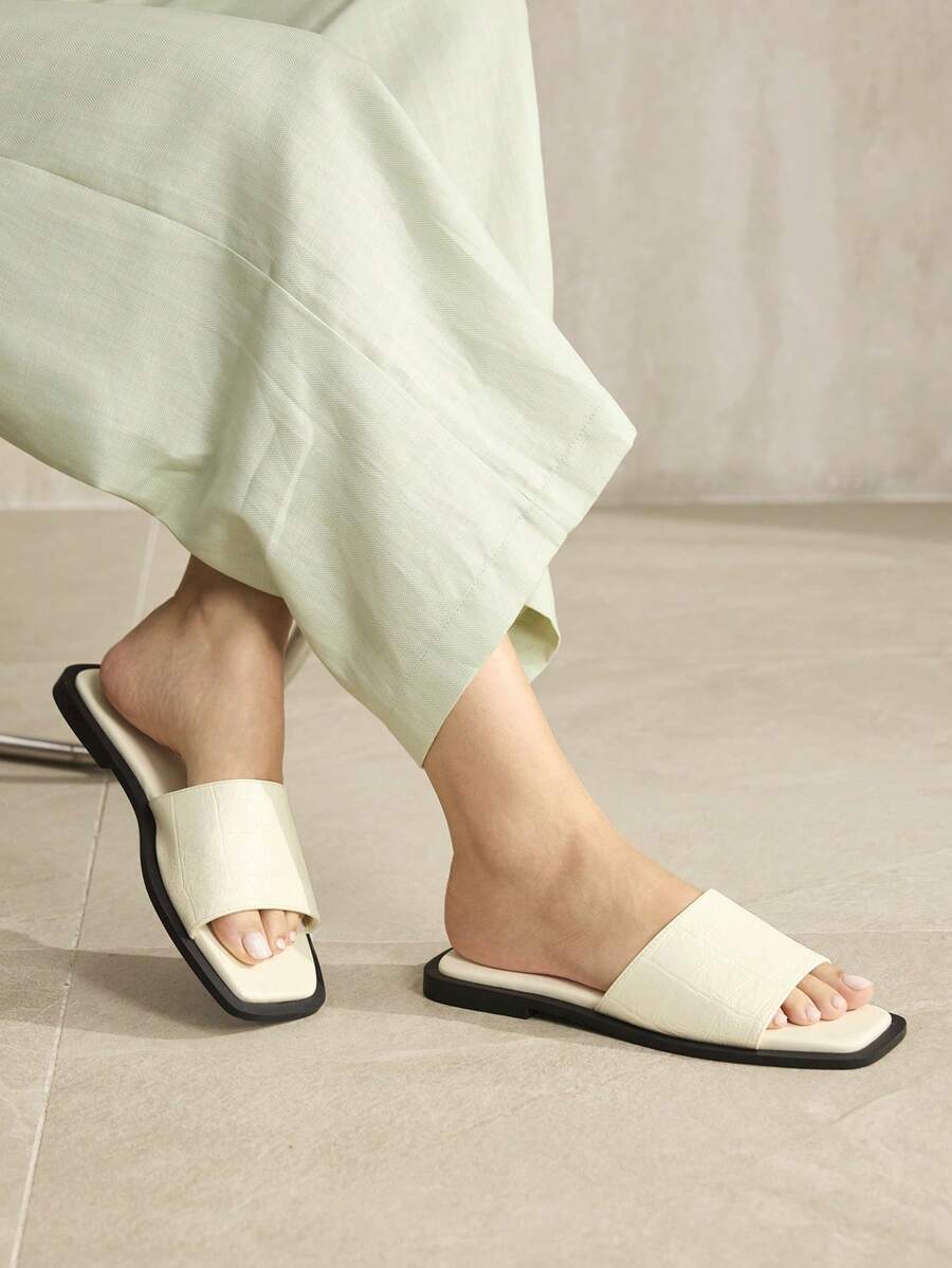 Retro women's square toe open toe flat slippers featuring a smooth PU leather finish and lightweight slip-on design.