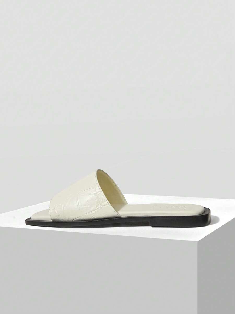 Retro women's square toe open toe flat slippers featuring a smooth PU leather finish and lightweight slip-on design.