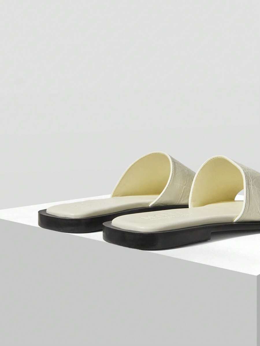 Retro women's square toe open toe flat slippers featuring a smooth PU leather finish and lightweight slip-on design.