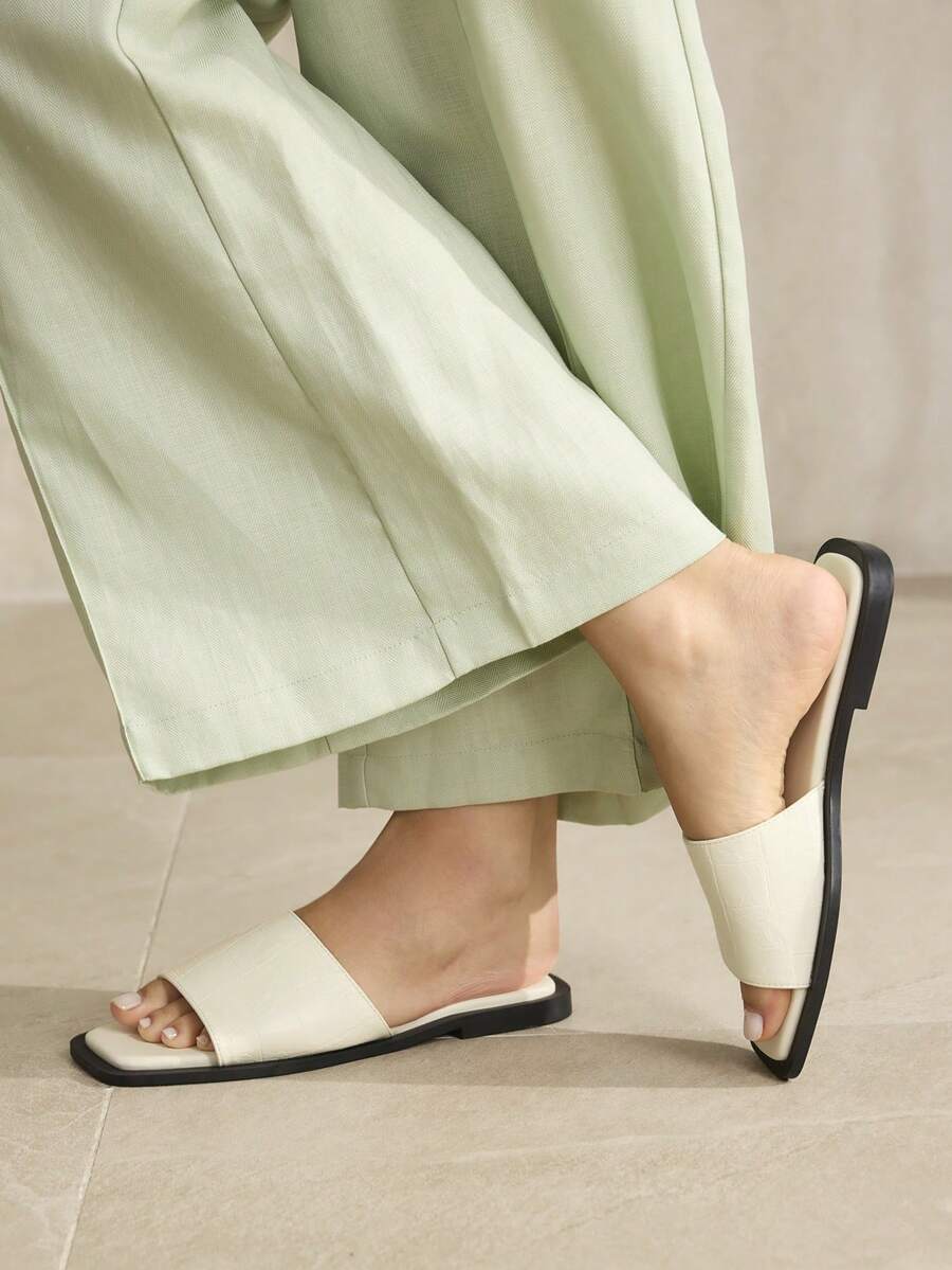 Retro women's square toe open toe flat slippers featuring a smooth PU leather finish and lightweight slip-on design.