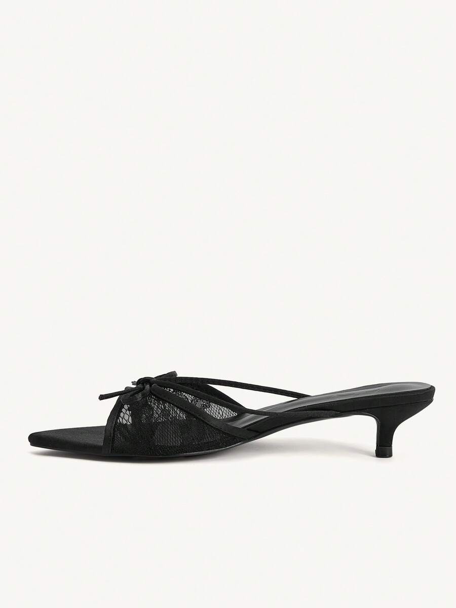 Pointed toe high-heeled slippers in PU leather with decorative buckle detail and low kitten heels for women.
