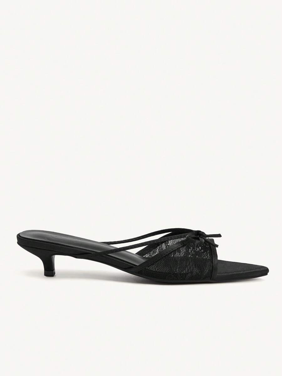 Pointed toe high-heeled slippers in PU leather with decorative buckle detail and low kitten heels for women.