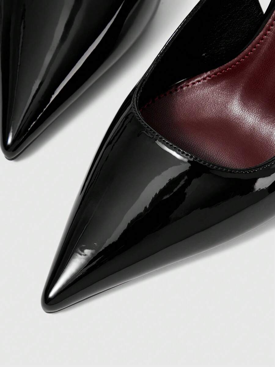 Women's pointed-toe high heel pumps in black mirror PU leather with an ankle strap, stiletto heel, and rhinestone buckle.