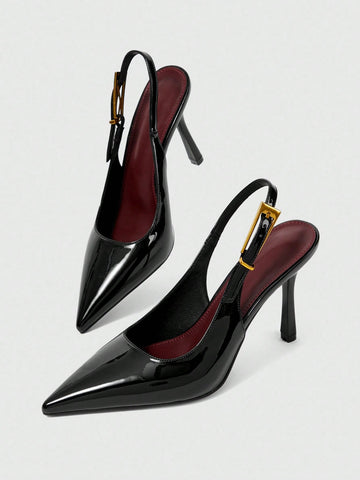 Women's pointed-toe high heel pumps in black mirror PU leather with an ankle strap, stiletto heel, and rhinestone buckle.