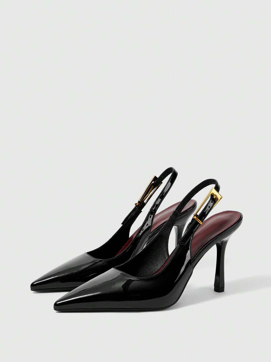 Women's pointed-toe high heel pumps in black mirror PU leather with an ankle strap, stiletto heel, and rhinestone buckle.