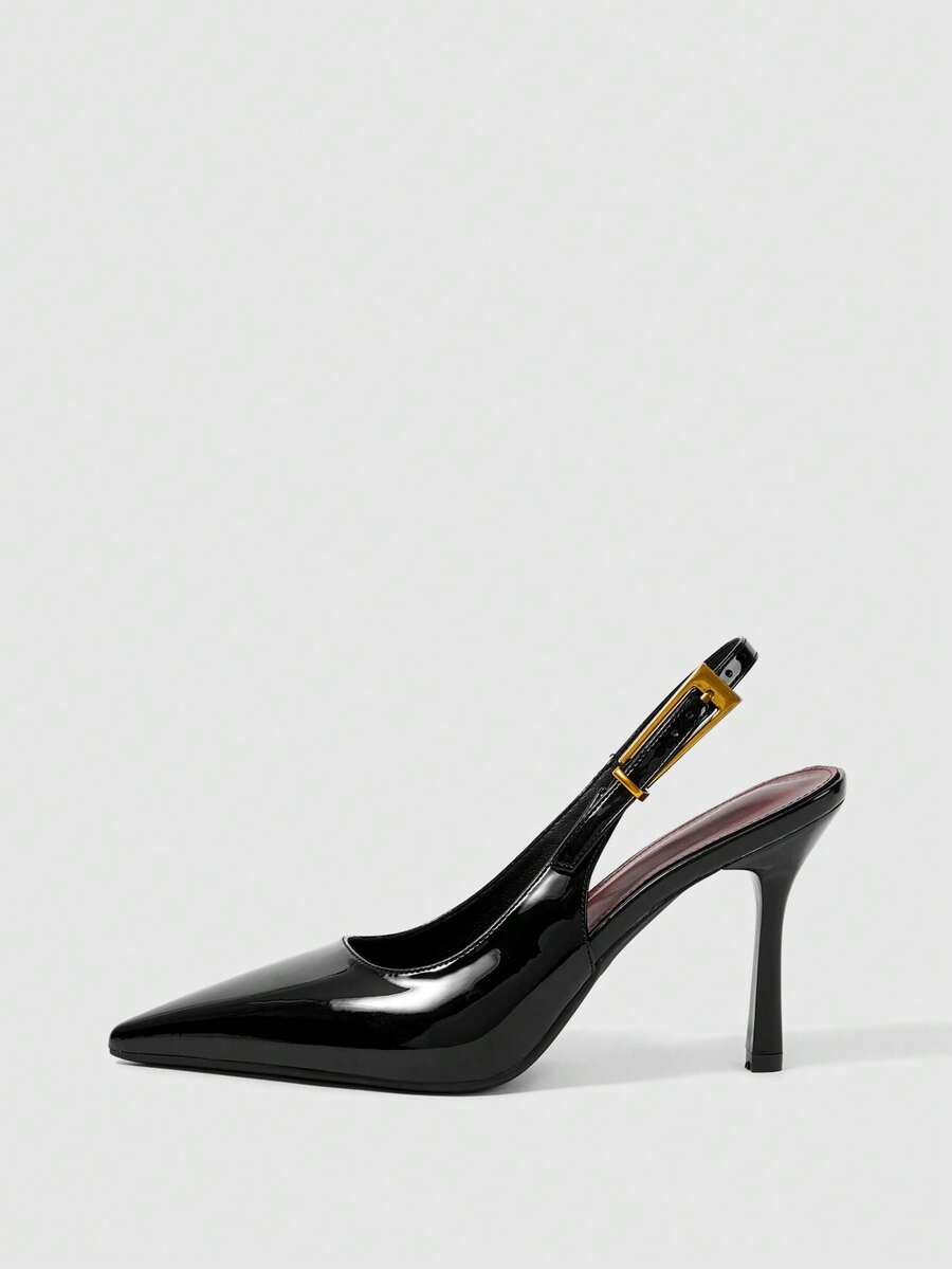 Women's pointed-toe high heel pumps in black mirror PU leather with an ankle strap, stiletto heel, and rhinestone buckle.