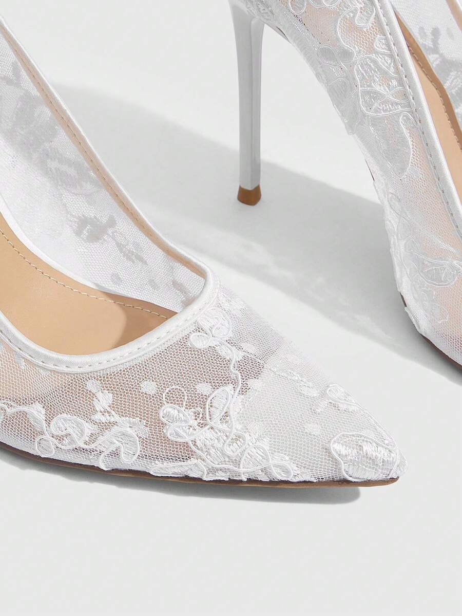 Women's pointed clear lace heels with contrast mesh, floral embroidery, and stiletto high heel with buckle strap.