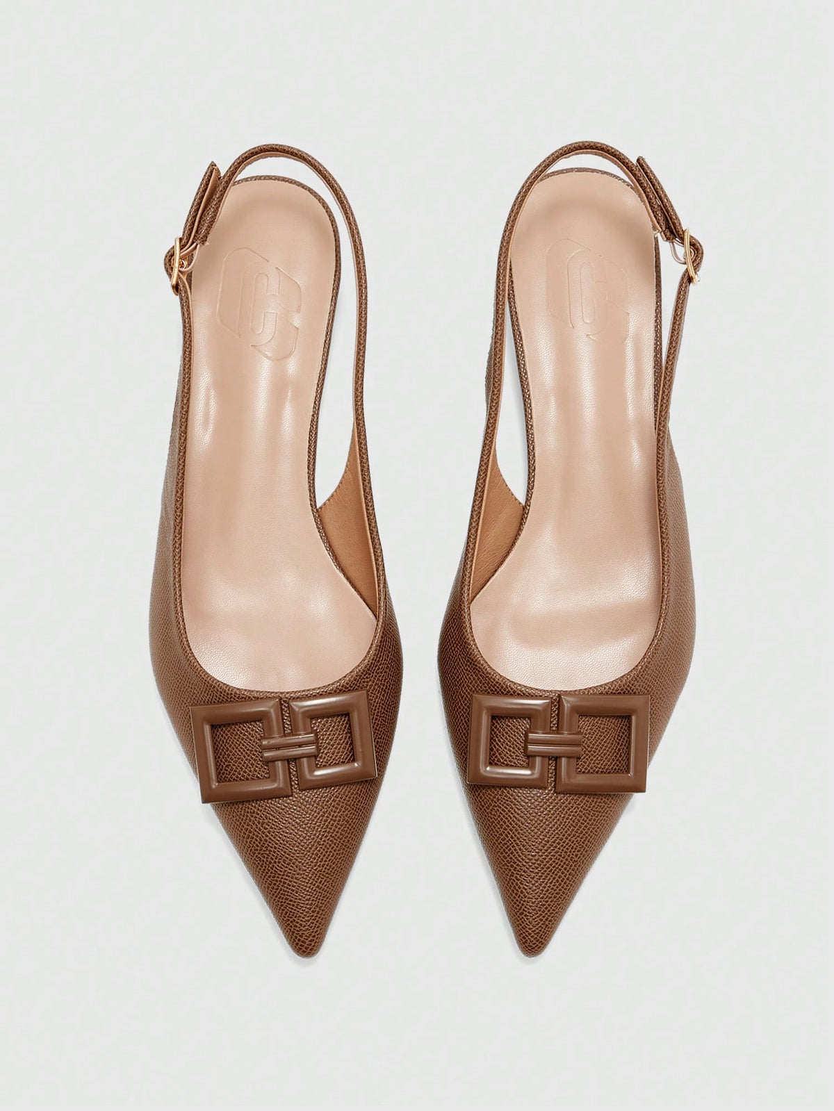 Women's pointed toe low wedge flat shoes crafted in PU leather with a slingback strap and stylish metal buckle detail.