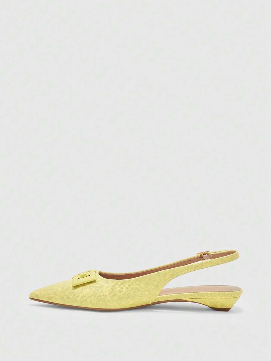 Women's pointed toe low wedge flat shoes crafted in PU leather with a slingback strap and stylish metal buckle detail.