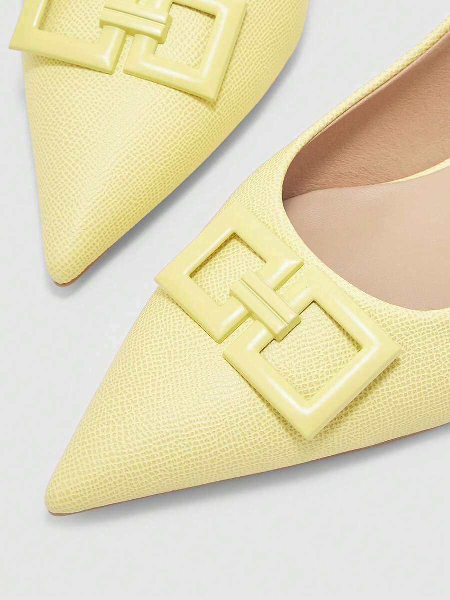 Women's pointed toe low wedge flat shoes crafted in PU leather with a slingback strap and stylish metal buckle detail.