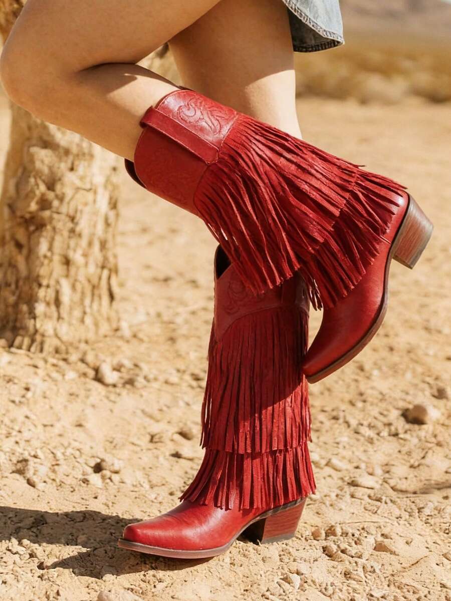 Women's camel suedette knee high western cowgirl boots featuring sparkling rhinestone fringe accents, a pointed toe, and a chunky block heel.