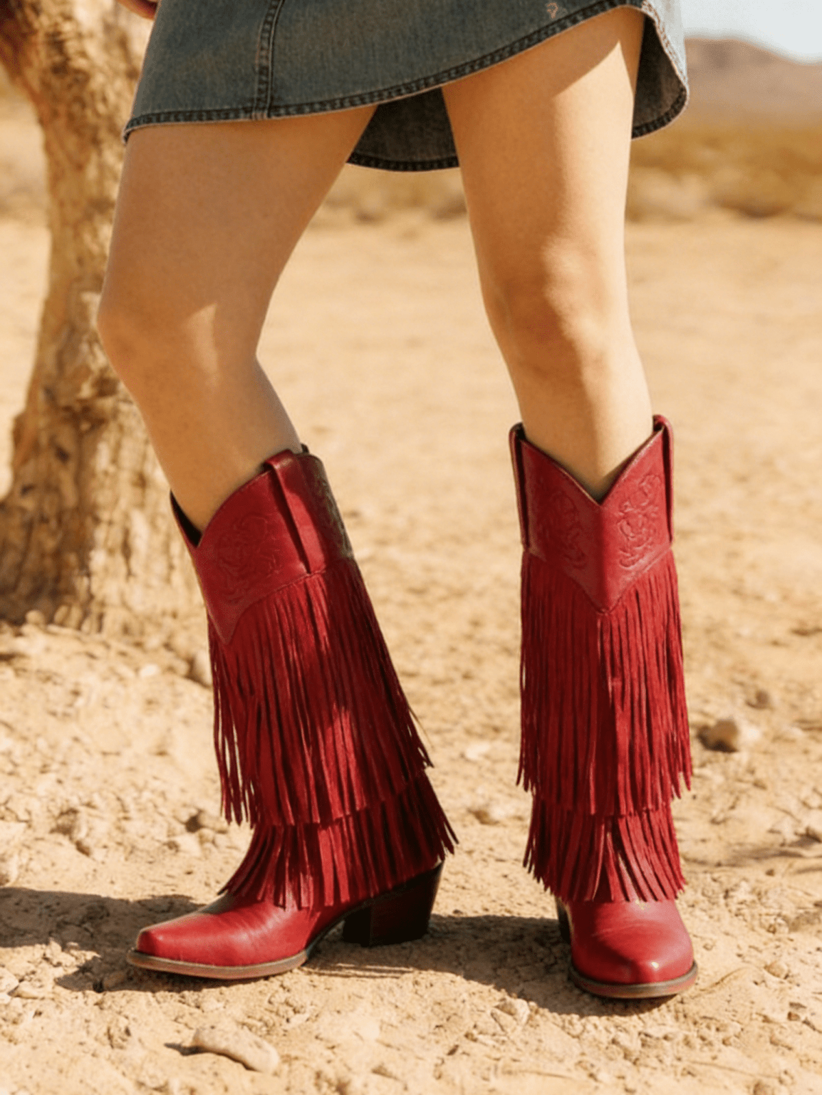 Women's camel suedette knee high western cowgirl boots featuring sparkling rhinestone fringe accents, a pointed toe, and a chunky block heel.