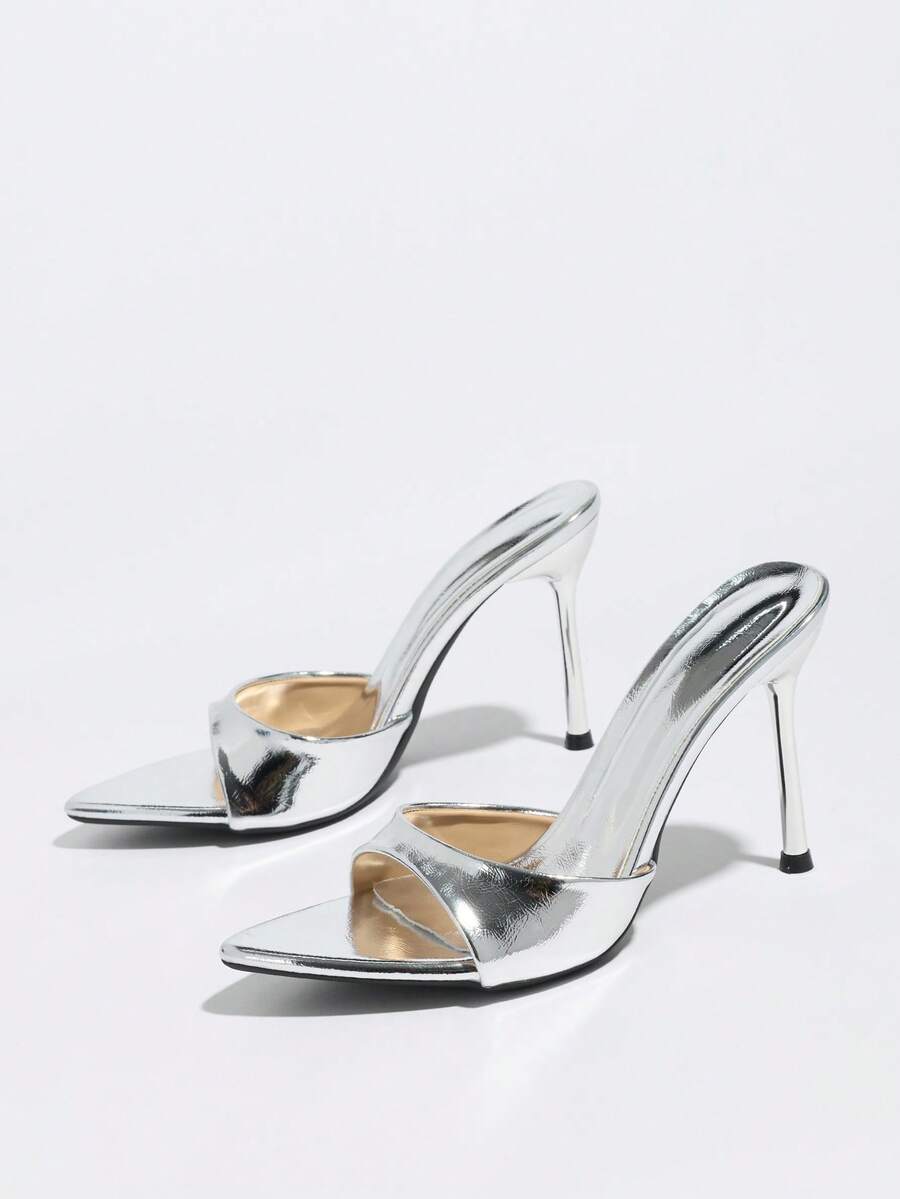 Women's elegant open toe high heel party mules featuring sleek stiletto heels and a slip-on design.