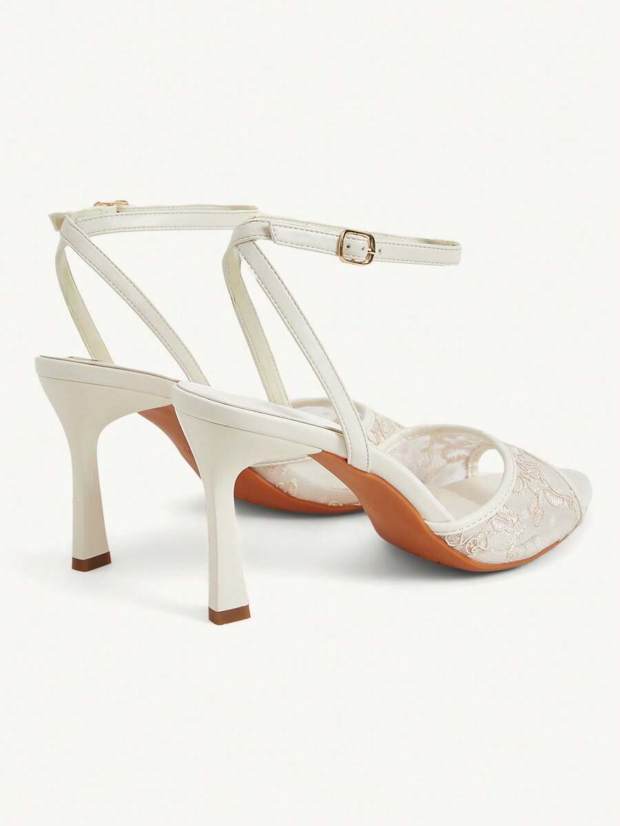 Women's open toe high heel sandals with lace mesh upper, stiletto heel, and ankle strap closure.