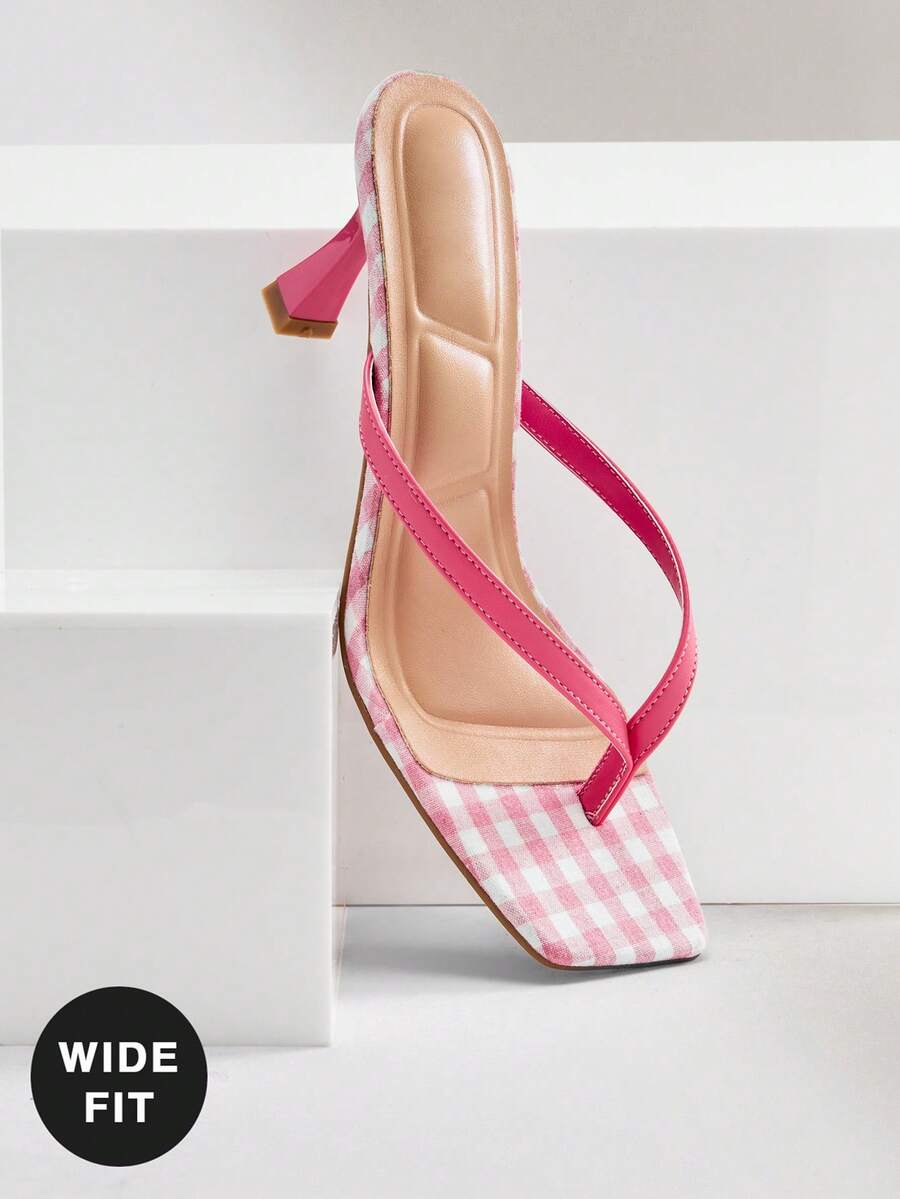 Women's square toe kitten heel thong heeled sandals featuring an asymmetrical strap design and mid heel