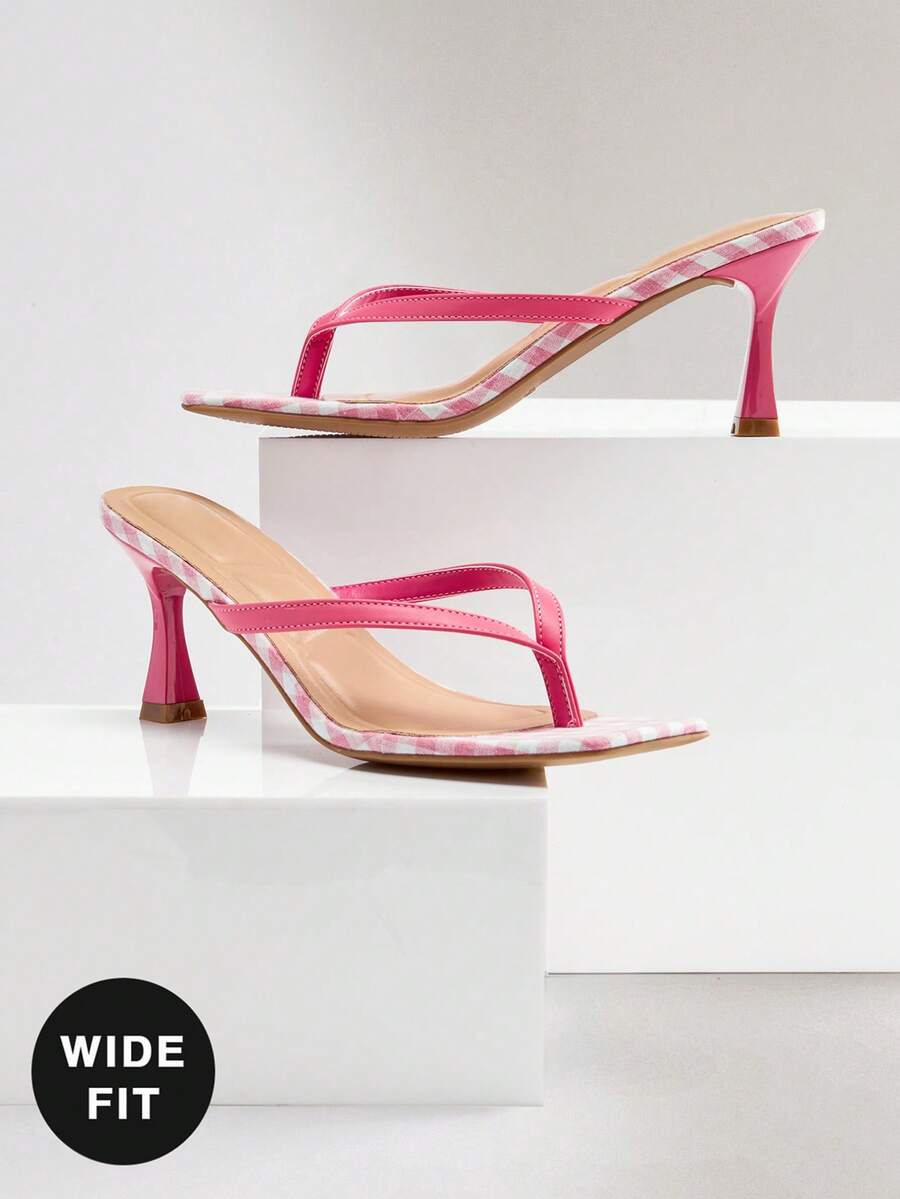 Women's square toe kitten heel thong heeled sandals featuring an asymmetrical strap design and mid heel