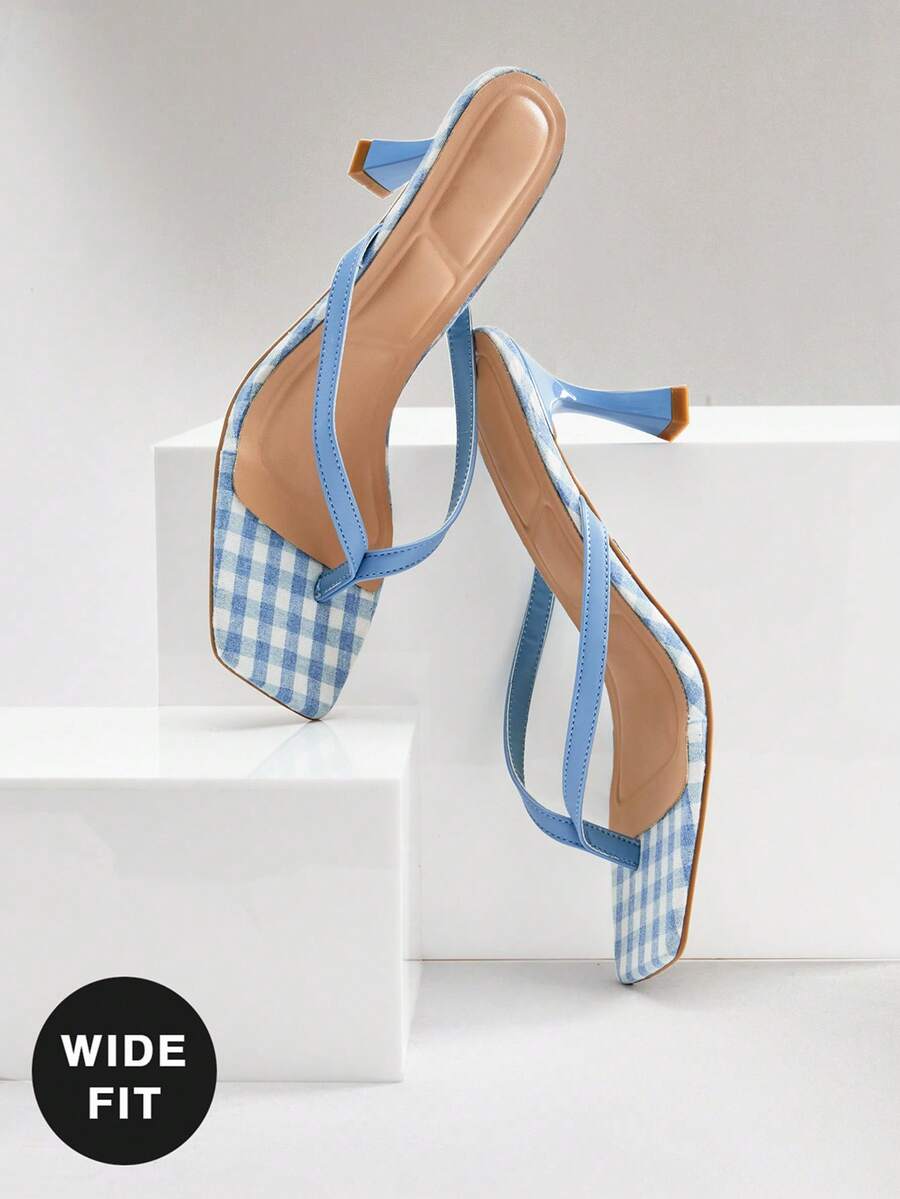 Women's square toe kitten heel thong heeled sandals featuring an asymmetrical strap design and mid heel