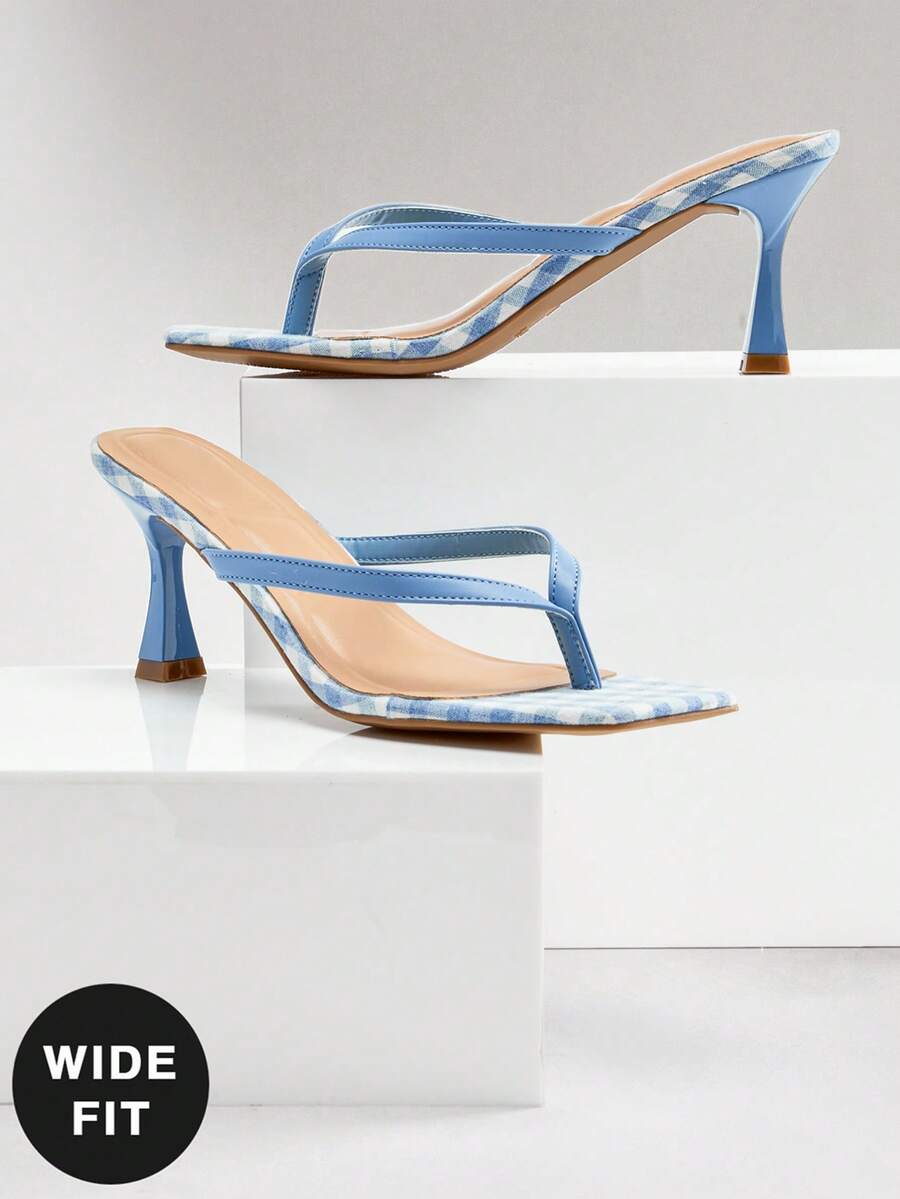 Women's square toe kitten heel thong heeled sandals featuring an asymmetrical strap design and mid heel