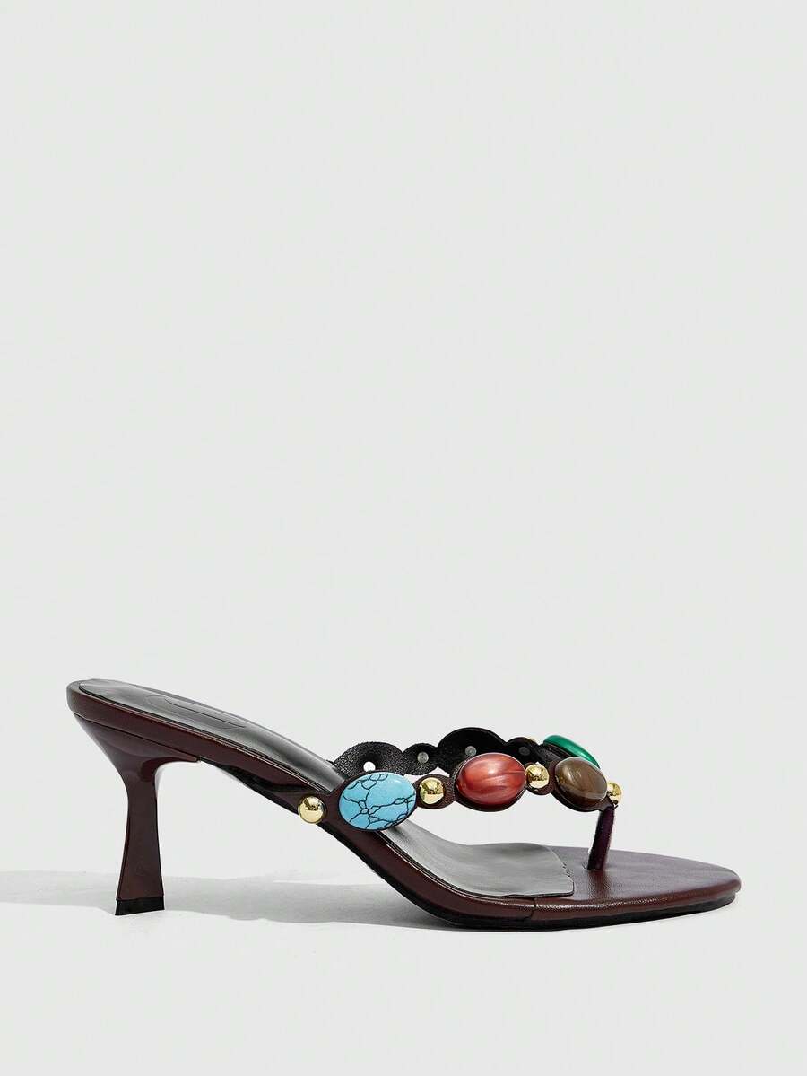 Elegant ladies strappy high-heeled slippers featuring a sleek toe post, buckle accent, and stiletto mid heel in smooth PU leather.