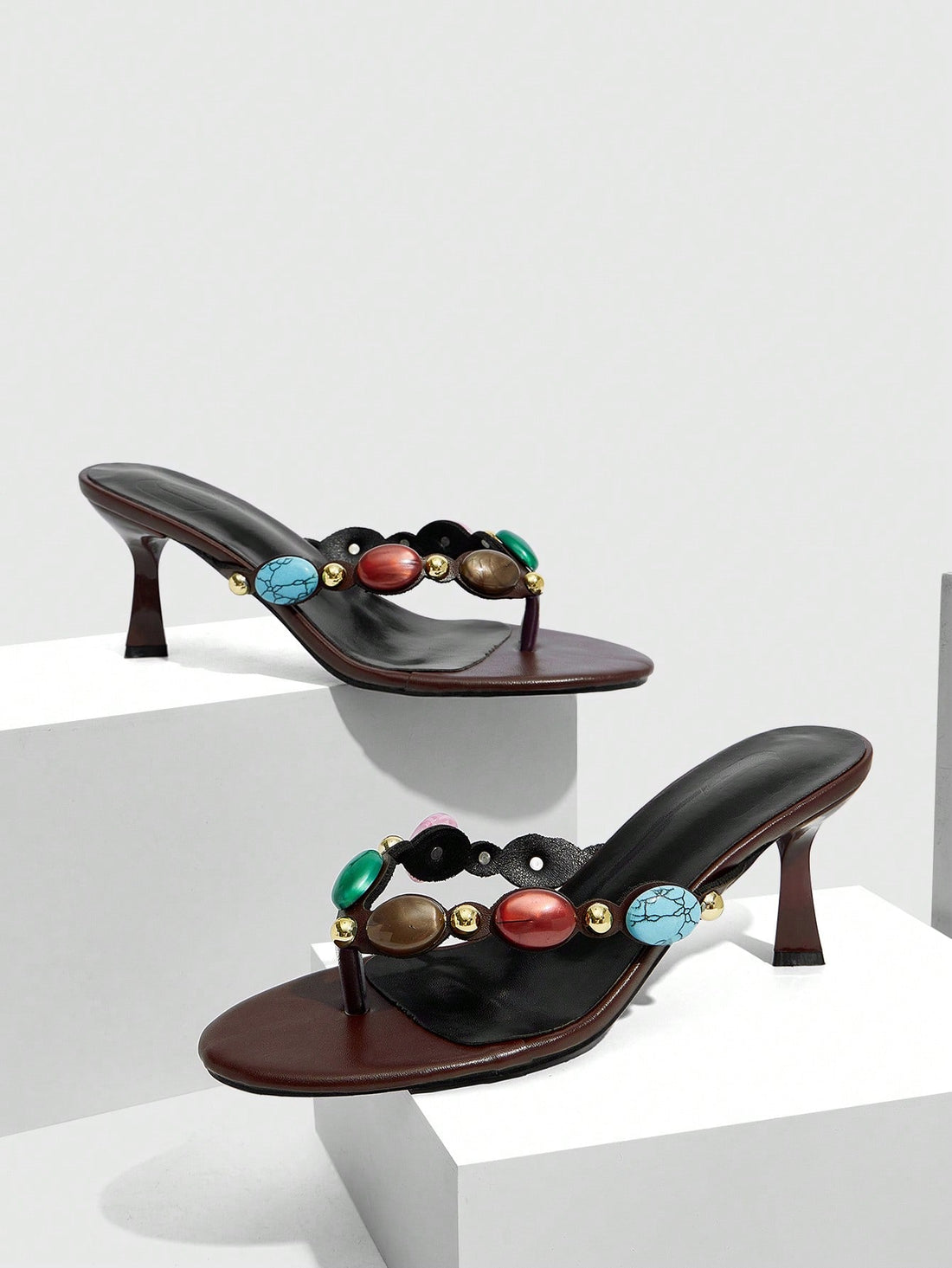 Elegant ladies strappy high-heeled slippers featuring a sleek toe post, buckle accent, and stiletto mid heel in smooth PU leather.