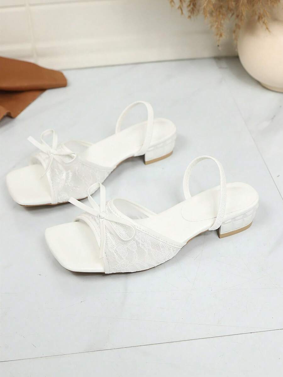 Square toe thin heel thong sandals for women featuring an open toe, bowknot detail, and slip-on slingback design.