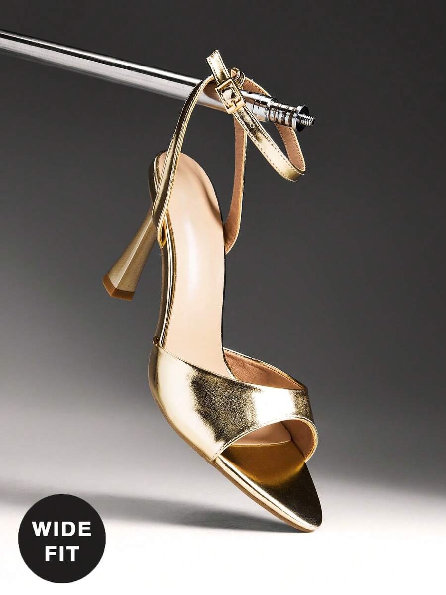 Women's wide-fit stiletto heel sandals featuring an open-toe design, slender mid stiletto heel, and adjustable ankle strap.