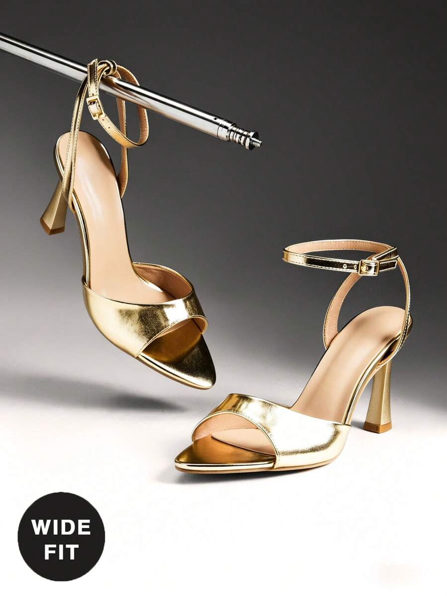 Women's wide-fit stiletto heel sandals featuring an open-toe design, slender mid stiletto heel, and adjustable ankle strap.
