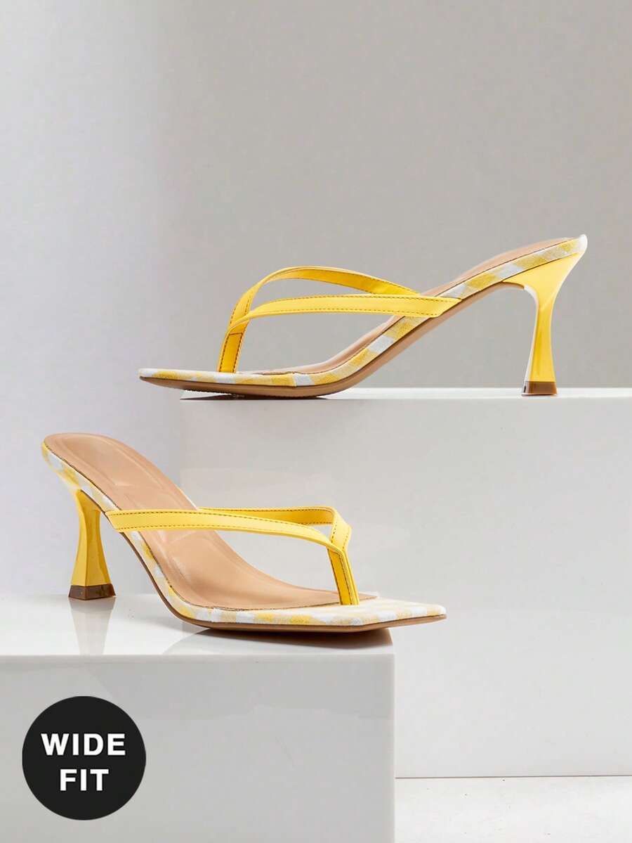 Women's square toe kitten heel thong heeled sandals featuring an asymmetrical strap design and mid heel