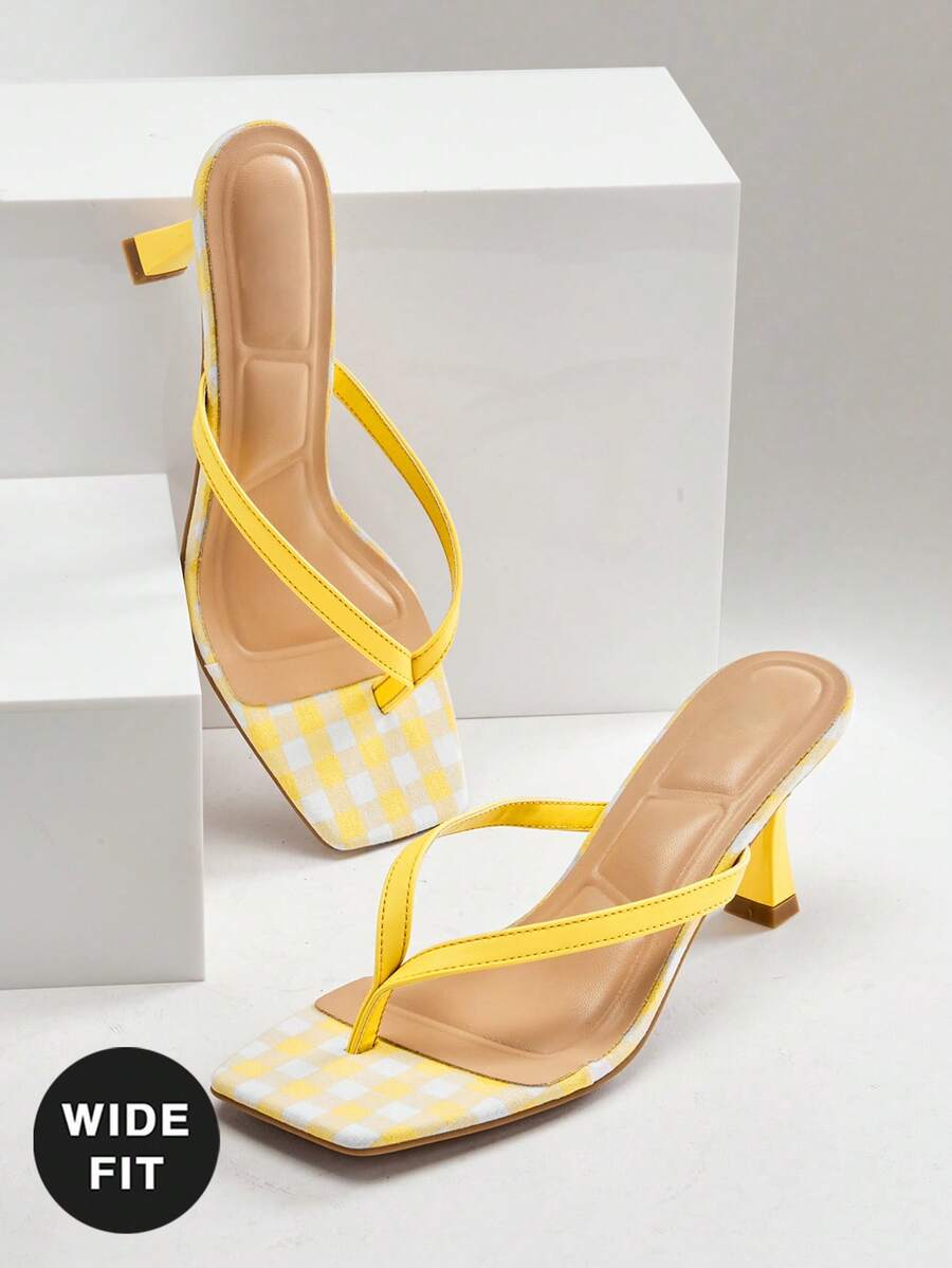Women's square toe kitten heel thong heeled sandals featuring an asymmetrical strap design and mid heel