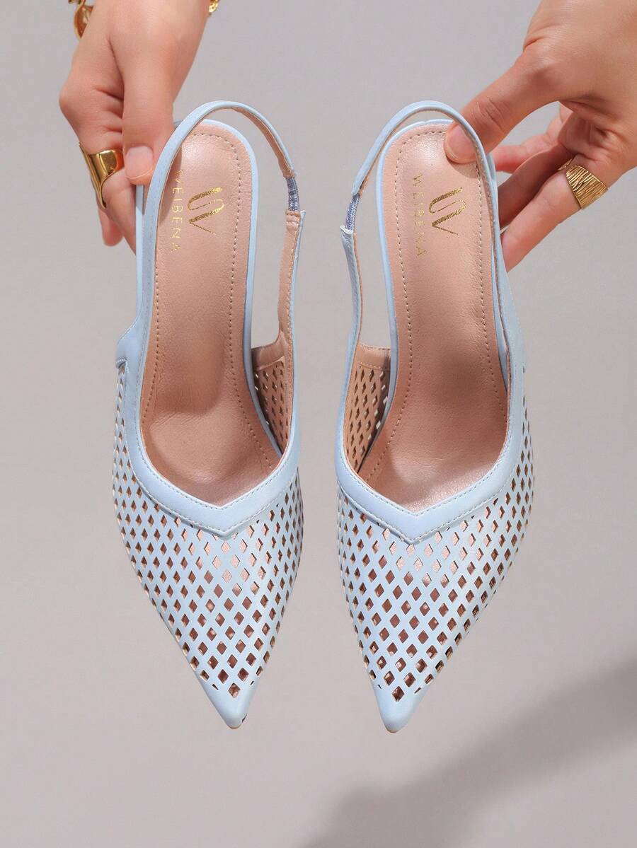 Lace embroidered high heels with thin stiletto heel, pointed toe, rhinestone embellishments, and ankle strap buckle closure.