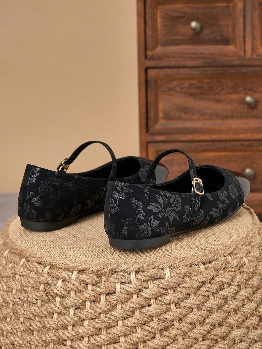 Pair of women's square toe slip-on flat shoes featuring a delicate bow detail and low vamp design.