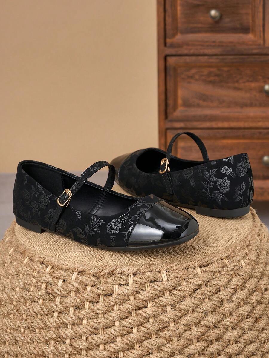 Pair of women's square toe slip-on flat shoes featuring a delicate bow detail and low vamp design.