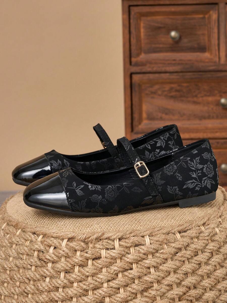 Pair of women's square toe slip-on flat shoes featuring a delicate bow detail and low vamp design.