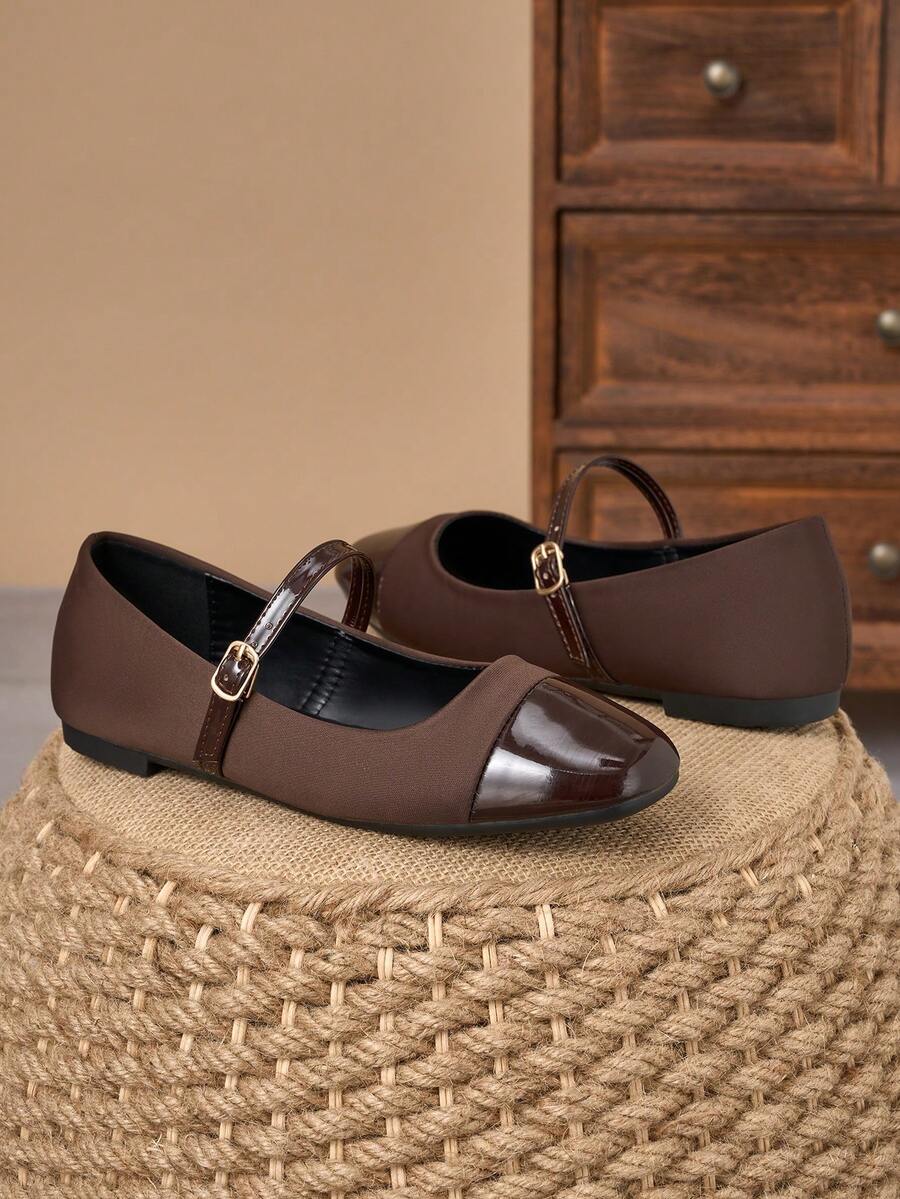 Pair of women's square toe slip-on flat shoes featuring a delicate bow detail and low vamp design.