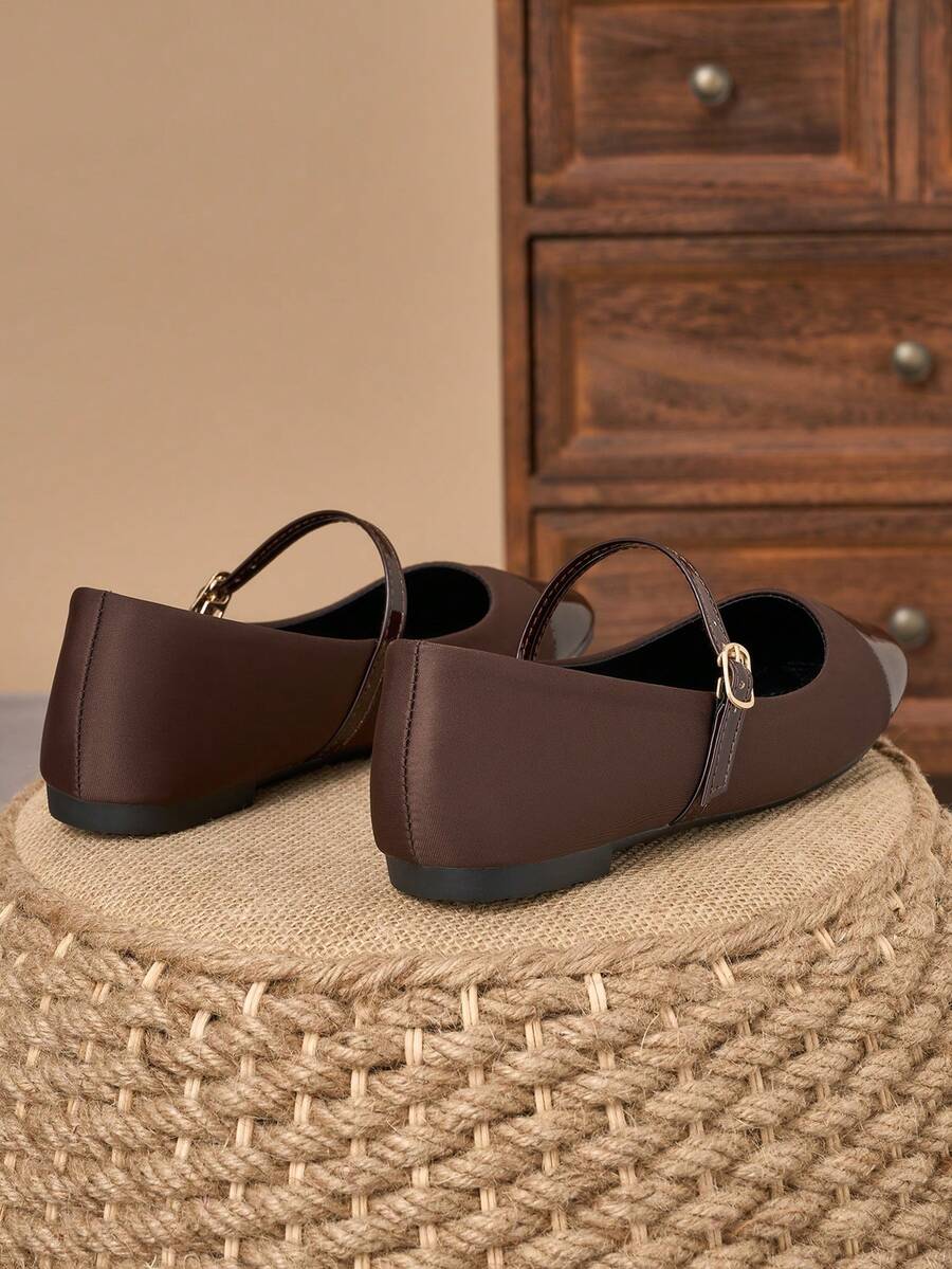 Pair of women's square toe slip-on flat shoes featuring a delicate bow detail and low vamp design.