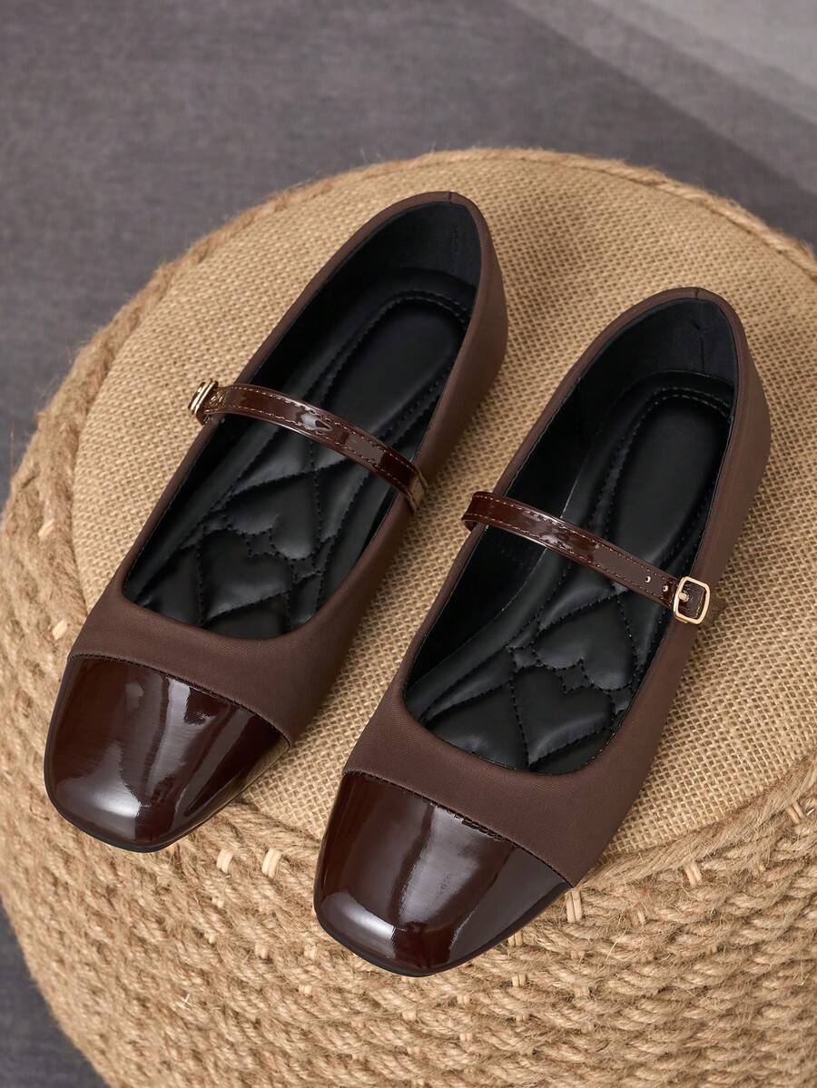 Pair of women's square toe slip-on flat shoes featuring a delicate bow detail and low vamp design.