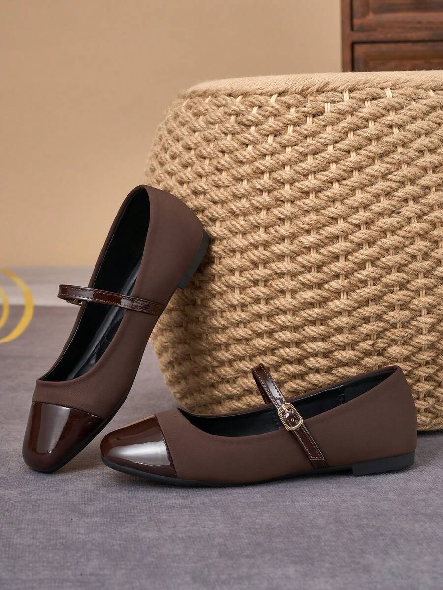 Pair of women's square toe slip-on flat shoes featuring a delicate bow detail and low vamp design.