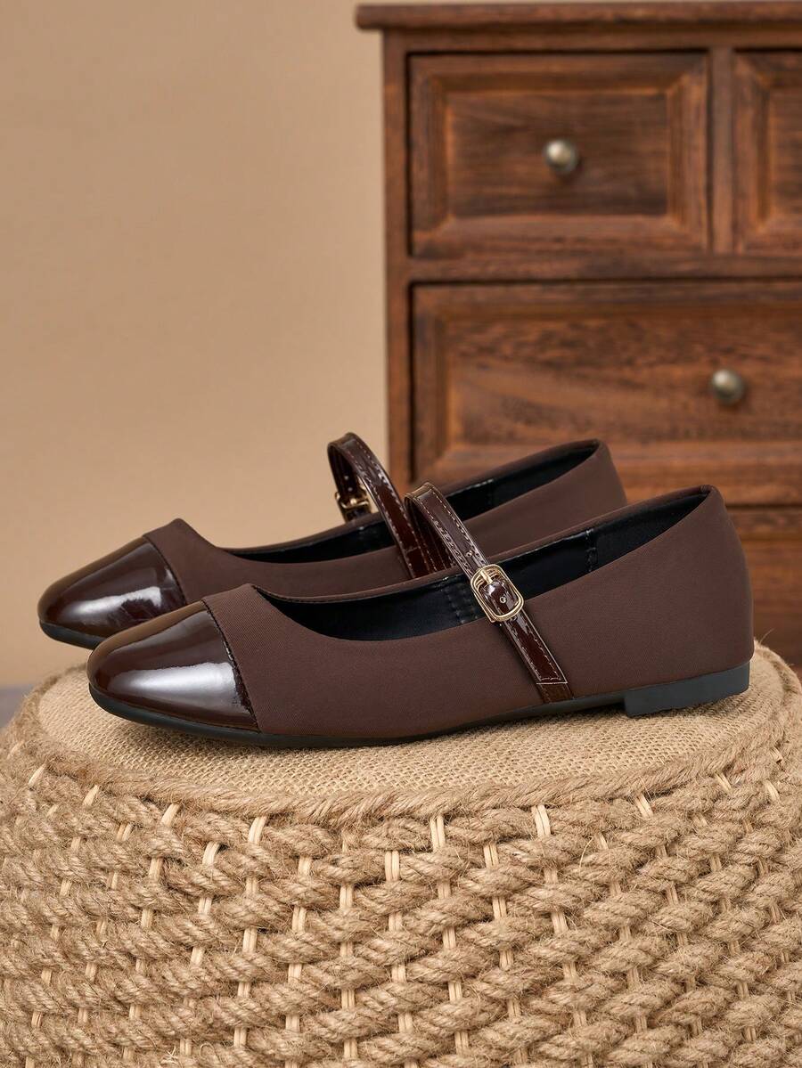 Pair of women's square toe slip-on flat shoes featuring a delicate bow detail and low vamp design.