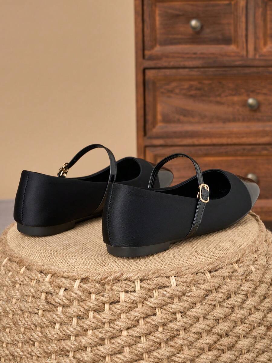 Pair of women's square toe slip-on flat shoes featuring a delicate bow detail and low vamp design.