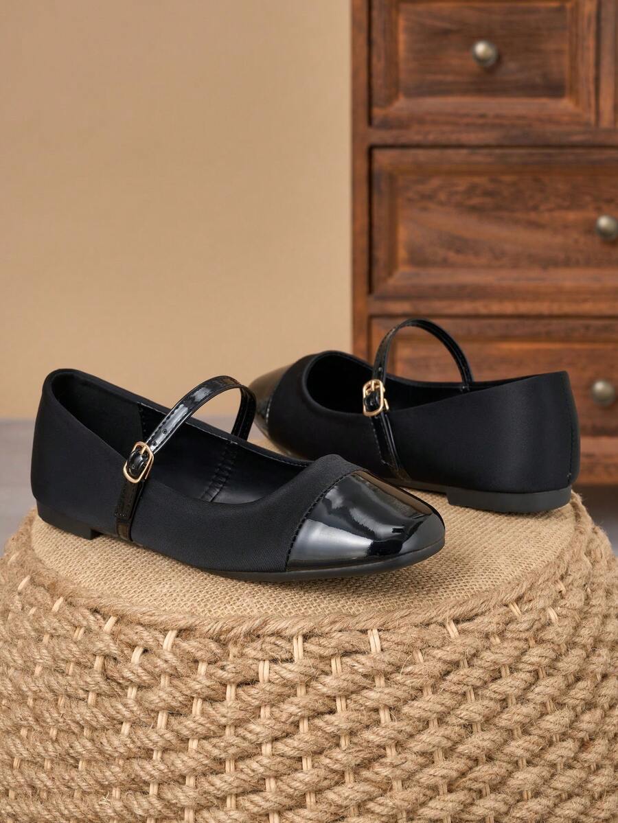 Pair of women's square toe slip-on flat shoes featuring a delicate bow detail and low vamp design.