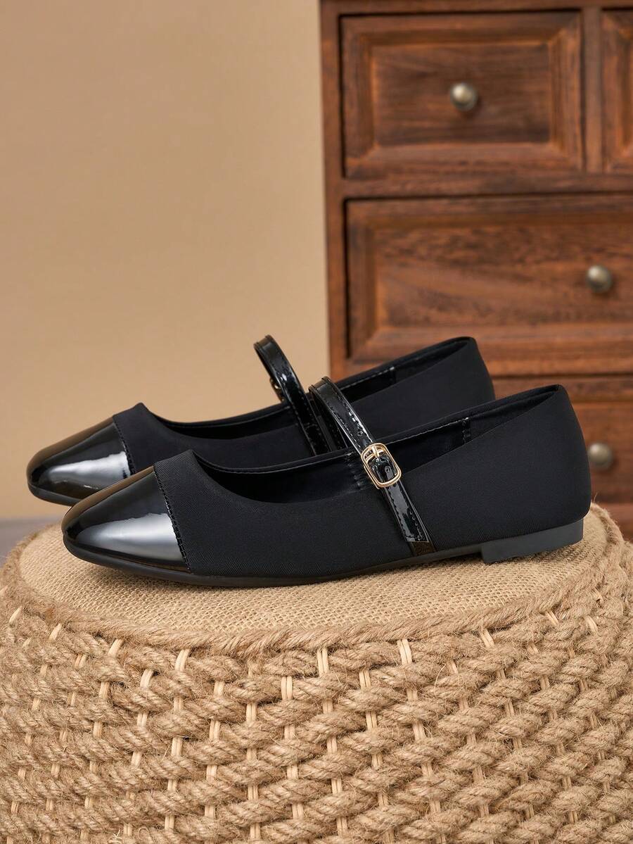 Pair of women's square toe slip-on flat shoes featuring a delicate bow detail and low vamp design.